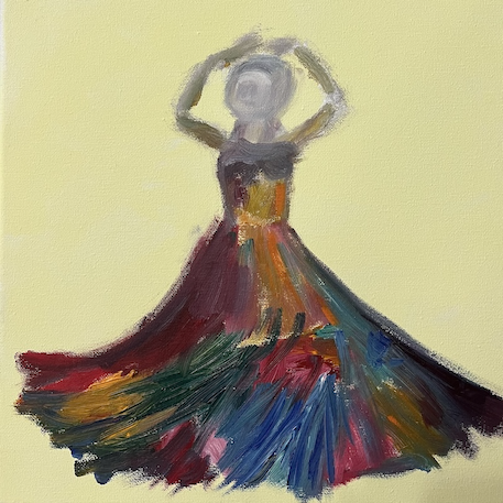 An anonymous flamenco dancer shows off her swirling dress of vivid colors.